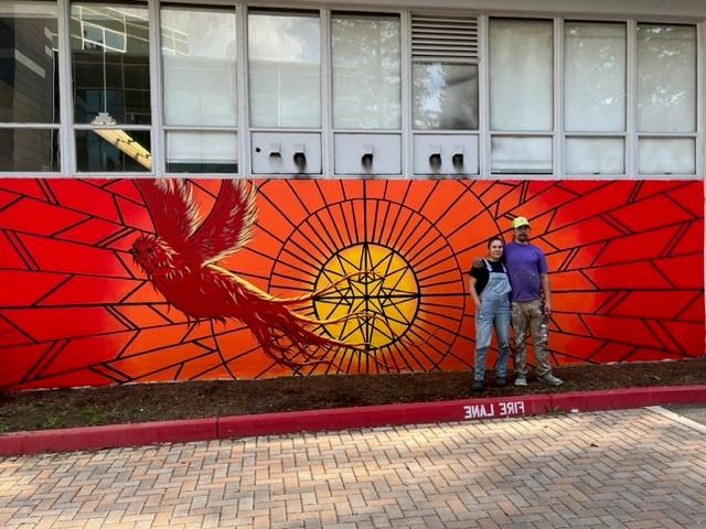 Nicole Sena in front of Becoming Mural